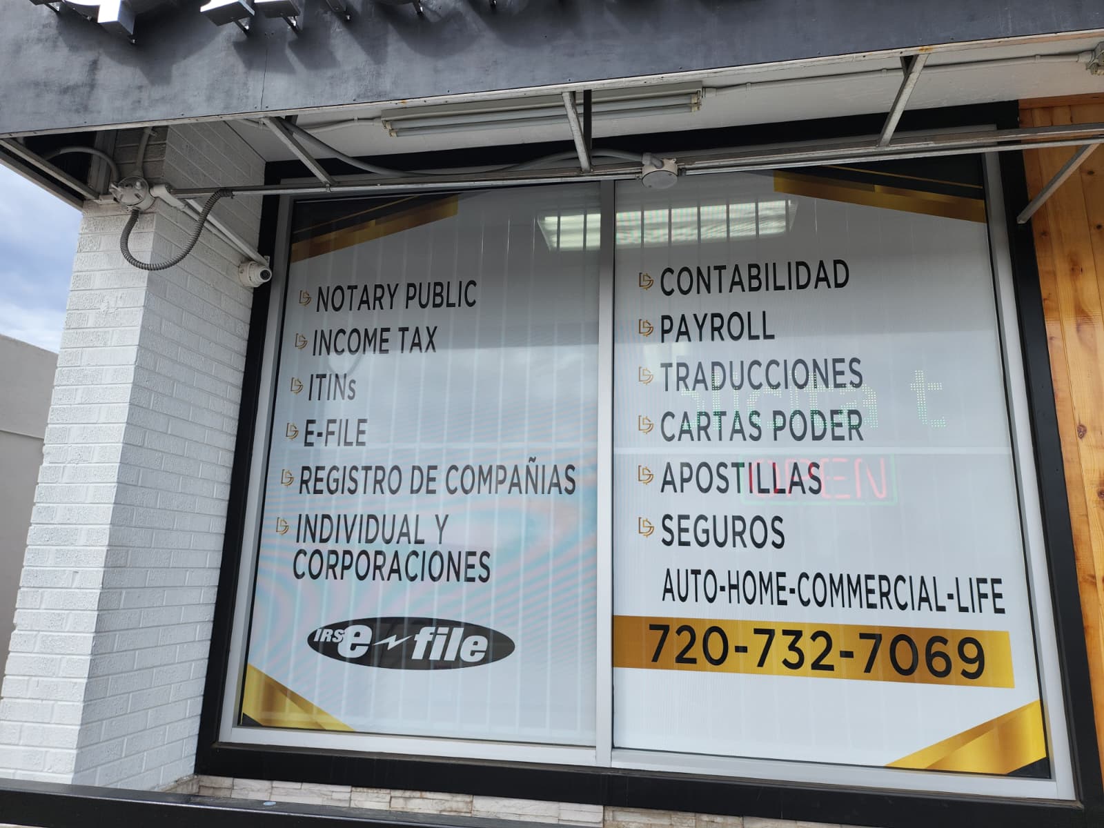 Del Sol Income Tax Services window perforated signs in Denver by Wrapido Denver